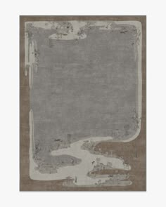 an area rug with grey and brown colors on the bottom, in front of a white background