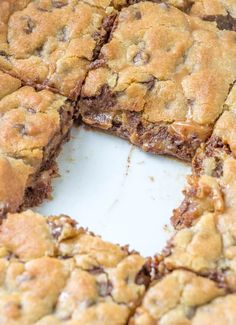 chocolate chip cookie bars cut into squares on a white surface