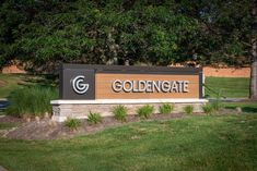 the sign for goldengate is shown in front of some trees and green lawns