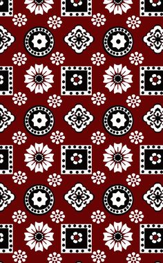 a red and black pattern with white flowers