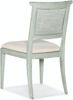 a white chair with an upholstered back and seat cushion on the bottom side