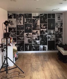 a room that has some pictures on the wall and a camera in front of it