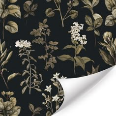 a black and white floral wallpaper with green leaves