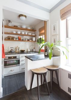 two stools are in front of the counter