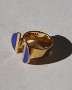 Indulge in elegance with our 24K Gold Vermeil Split Top Crescent Lapis Enamel Ring, a captivating piece from the Diasporan Voyage Collection. Crafted in collaboration with Chee Lee Designs, this ring features a unique split top design in 24K Gold Vermeil , adorned with lustrous crescents in lapis enamel. This ring is a statement of modern style interwoven with the rich tapestry of African heritage. Experience the fusion of luxury and cultural significance with this timeless addition to your jewelry collection. Lapis blue enamel 24K Vermiel Don't see your size? Don't worry these can be made to order. Email us at marcheruedix@gmail.com for inquires. Crescent Ring, Split Top, Lapis Blue, Enamel Ring, Top Design, Gold Vermeil, Don't Worry, Crescent, Modern Style