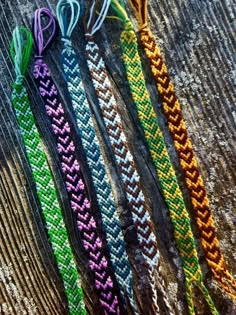 five braided bracelets sitting on top of each other