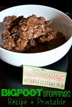 a white bowl filled with brownies next to a green sign that says bigfoot droppings recipe + printable