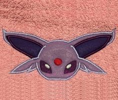 a close up of a towel with a pikachu face on it's side