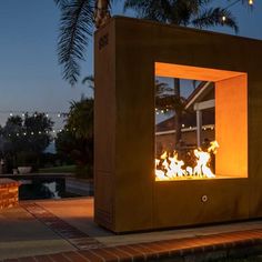 a fire pit sitting on top of a brick patio