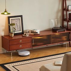 a living room with a couch, chair and entertainment center