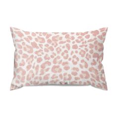 a pink and white leopard print pillow on a white background