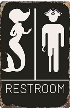 a sign that says restroom with a man and woman standing next to each other