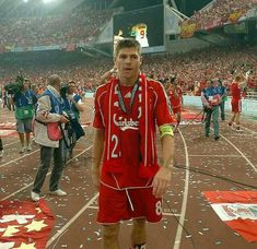 a man standing on top of a track with confetti all over his face