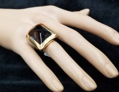 FASHION ITALIAN DESIGN 18K YELLOW SOLID GOLD BLACK ONYX RING CENTER NATURAL BLACK ONYX SIZE 20X15 GORGEOUS BLACK ONYX CLEAN ,VERY NICE CUT ,LIVELY STONE.NICE LUSTER. RING size 6.5 Ring measure one inch long 28mmx21mm Ring weighs 19.7 grams Retail value $8,500 net . Appraisal available Gold Gemstone Rings For Evening, Designer Black Enamel Rings For Gift, Designer Black Ring With Black Enamel, Designer Black Rings For Anniversary, Designer Black Enamel Ring, Gold Rings With Polished Finish For Evening, Designer Black Jewelry With Polished Finish, Designer Yellow Gold Rings For Evening, Formal Gold Onyx Rings