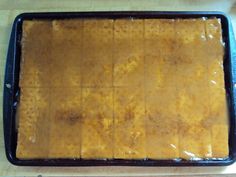 a pan filled with food sitting on top of a wooden table