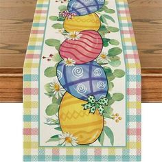 an easter table runner with eggs on it