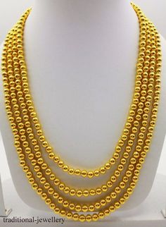 20 karat gold design handmade necklace chain, fabulous gifting jewelry for unisex from Rajasthan India.weight-43.5 grams approx.metal-20 karat yellow gold.brand-handmade.length- 18 inch to 22 inch slop pattern and can be adjusted by back thread or knotwidth-5 mm approx.there is wax inside the ballscondition-excellent brand new jewelry.contact for customization in length.note-gold jewelry is handmade designer jewelry so there can be slight difference in comparison of article and description. Gold Jewelry With 108 Round Beads, Gold Mala With 108 Beads As Gift, 22k Gold Round Beads Yellow Necklace, Yellow 22k Gold Necklaces With Round Beads, Gold Mala With Round Beads For Festivals, Gold Temple Necklace With Round Beads For Festivals, Yellow 22k Gold Necklace With Round Beads, Gold Polished Beads Mala For Wedding, Gold Temple Necklace With Round Beads