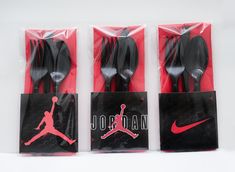 four black and red jordan spoons in plastic bags