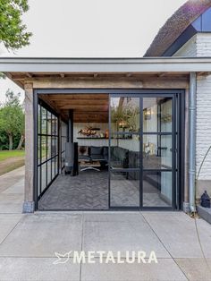 an open patio with sliding glass doors leading into the living room