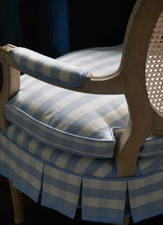 a chair with blue and white striped cushions