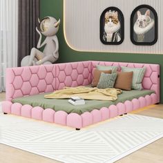 a living room with pink and green furniture