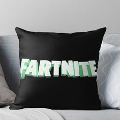 a black and green throw pillow with the word fortnite printed in white on it