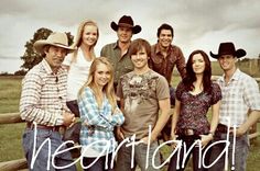 a group of people standing next to each other in front of a wooden fence with the words, westland on it