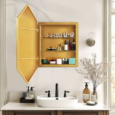 a bathroom with two sinks and shelves on the wall