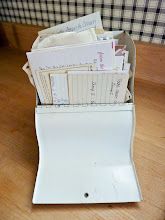 an open file folder sitting on top of a wooden table