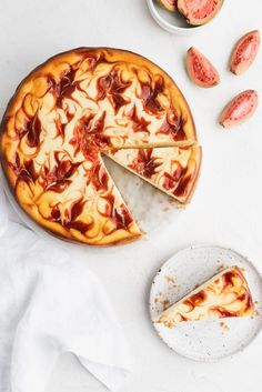 a cheesecake on a plate with one slice cut out and the rest sliced off