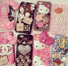 hello kitty phone cases are lined up on a white surface with pink flowers and bows