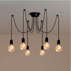 a chandelier with five light bulbs hanging from it's center and four lights on each side