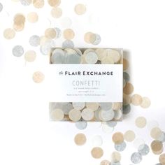 the confetti coin exchange is shown in front of a white background with gold and silver circles