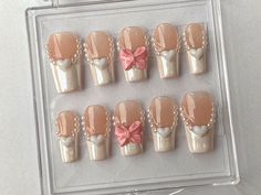 💅 Step into a world of glamour and sophistication with our luxurious French Tips Press On Nails Coffin set!  🌟 Discover the beauty of timeless elegance with the enchanting Franchie Pink and White Nail Set, designed to captivate and inspire.  💕 Let your nails become a work of art with the intricate 3D Gel Heart Designs that add depth and dimension to your style.  🎀 Embrace your individuality with the charming Ribbons in Fake Nails, a unique and delightful touch that sets you apart from the re Nails With Rose Charms, Rose Charms On Nails, Pearl Heart Charm Nails, Douyin Press On Nails, Rose Nail Charm, Nails Today, Really Cute Nails, Nail Shop, Heart Nails