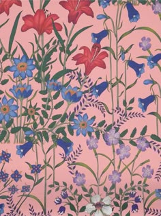 a pink wall with blue and red flowers on it