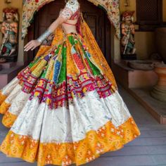 This Stunning Lehenga Choli Is Made Of Butter Silk And Comes With A Beautiful Choli And Dupatta With Heavy Mirror Work . It Is Multi Color With Intricated Mirror Work. It Is A Must Have In Your Ethnic Wardrobe, A Perfect Blend Of Style And Comfort. Printed Lengha, Dandiya Dress, Lengha Blouse, Choli Blouse Design, Navratri Lehenga, Desi Clothing, Navratri Garba, Navratri Collection, Mirror Work Lehenga