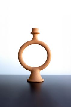 a wooden vase sitting on top of a table