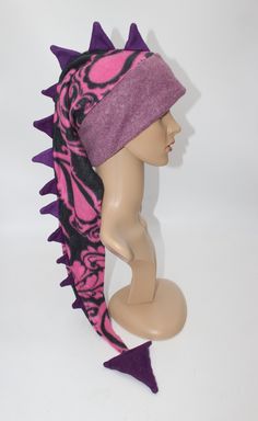 "This listing is for the hat pictured, you will receive this exact hat.  Who wouldn't want an absolutely awesome hat that can be a scarf too?? This hat is 24-36\" long from brim to end spike and is can wrap around your neck for added warmth! With its eye-catching pattern and long row of spikes, everyone you encounter will wonder where you got such a great hat and will want one for themselves! Hat is sized to fit any ages from 4 years old and up- fits kids, adults, and teens alike. Extra stretchy Adjustable Beanie Costume Hat For Winter, Adjustable Beanie For Winter, Casual Winter Headwrap One Size, Fitted Costume Hats And Headpieces For Winter Festival, Adjustable Casual Beanie Costume Hats, Fun One-size Winter Hat, Casual Winter Headwrap One Size Fits Most, Fun Winter Costume Hat, One Size Fits Most, Adjustable Warm Winter Costume Hats And Headpieces