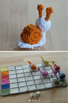 crocheted toy animals sitting on top of a wooden table next to each other