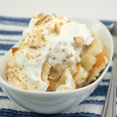 a bowl filled with ice cream on top of a blue and white towel