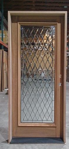 a wooden door with a glass window in it