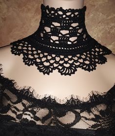 a woman wearing a black lace choker with crochet on the neckline