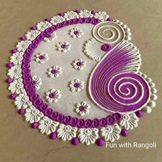 a purple and white doily with flowers on it