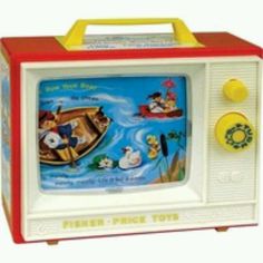 a toy television with cartoon characters on it's front and back sides, in the shape of a boat