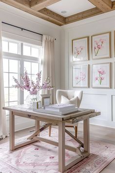 a living room filled with furniture and pictures on the wall behind a table in front of a window