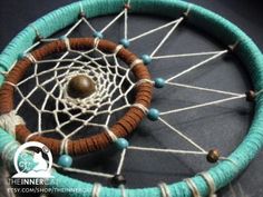 a close up of a beaded dream catcher