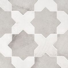 a white and grey tiled floor with hexagonal shapes