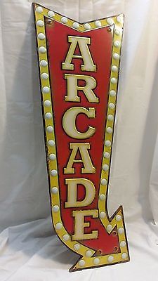 an old neon sign that says arcade on it's side and has the word arcade written