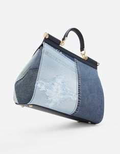 Large Sicily bag in calfskin and patchwork denim: Blue Front flap with hidden double magnetic fastening Logo tag featuring two metal plating finishes Top handle and adjustable, detachable strap in calfskin Printed fabric lining Inner pocket with branded zipper and a cell phone holder Metal feet studs on the base Item comes with a branded dust bag Measurements: H22 x W25 x D12 cm Made in Italy Luxury Denim Bags With Double Handle, Luxury Denim Bag With Double Handles, Luxury Denim Shoulder Bag With Double Handle, Luxury Denim Tote Bag, Designer Denim Travel Bag, Luxury Denim Double Handle Shoulder Bag, Luxury Denim Blue Denim Bag, Luxury Denim Tote Shoulder Bag, Blue Denim Bag With Top Carry Handle