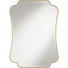 a gold framed mirror on a white background